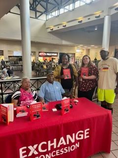 Author Walter Beamon and his wife, Ikie, shares a moment with three customers at Lackland Main Exchange on Lackland AFB, Texas on June 26, 2024.